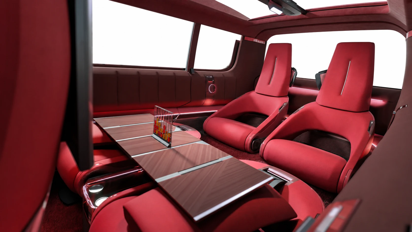 Innenraum des Renault E-Space Concept mit roten Einzelsitzen, Tisch und Glasdach.
